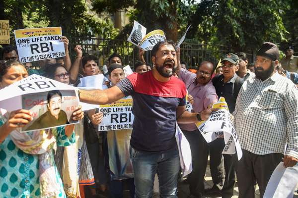 As Cracks Among Depositors Appear Protests Against Pmc Bank